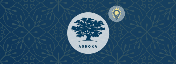 Logo of Ashoka tree in a dark blue surrounded by a light blue circle, with a yellow lightbulb off to the diagonal right (also within a small light blue circle). Rest of the banner is dark blue with ornate designs