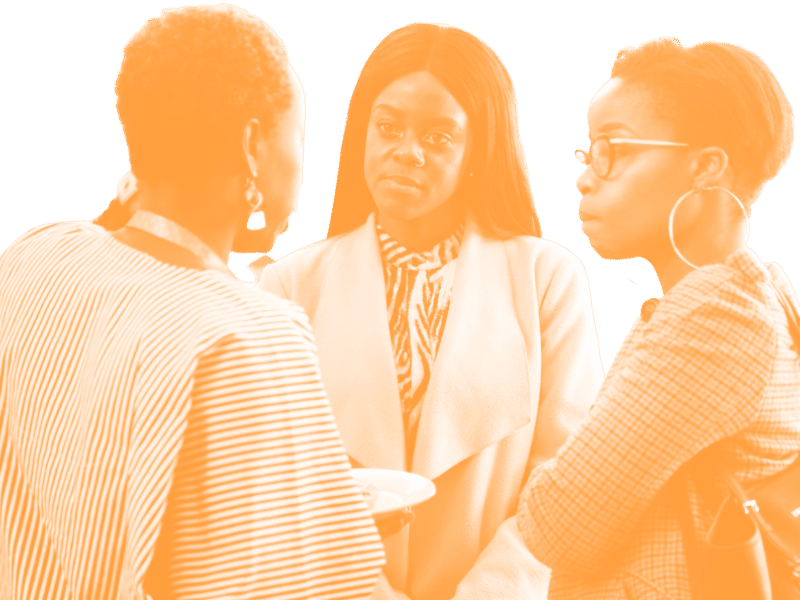 3 girls chatting over coffee at Impact Africa Summit
