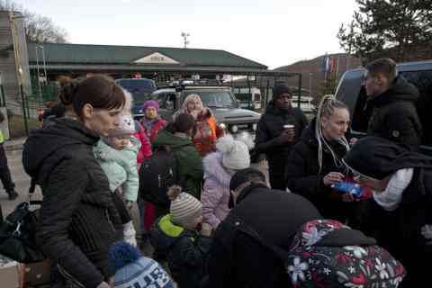 People crowding waiting for food