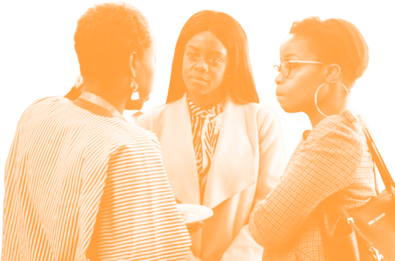 3 girls chatting over coffee at Impact Africa Summit