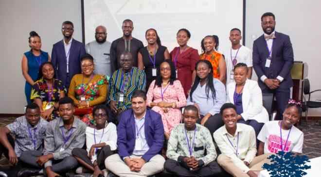 Photo of a group of people in three levels and three rows: sitting, kneeling and standing. Photo shows the Ashoka Nigeria team as well as 6 Young Changemakers at a launch event for the EACH movement in Nigeria