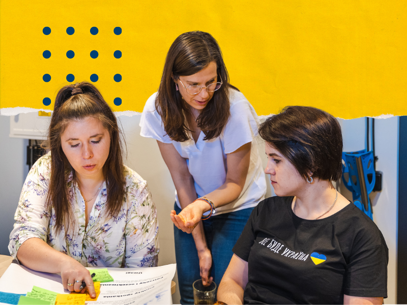 Three women working on buisness canva